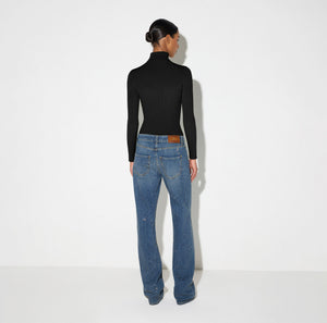Knit turtleneck top with openwork embroideries